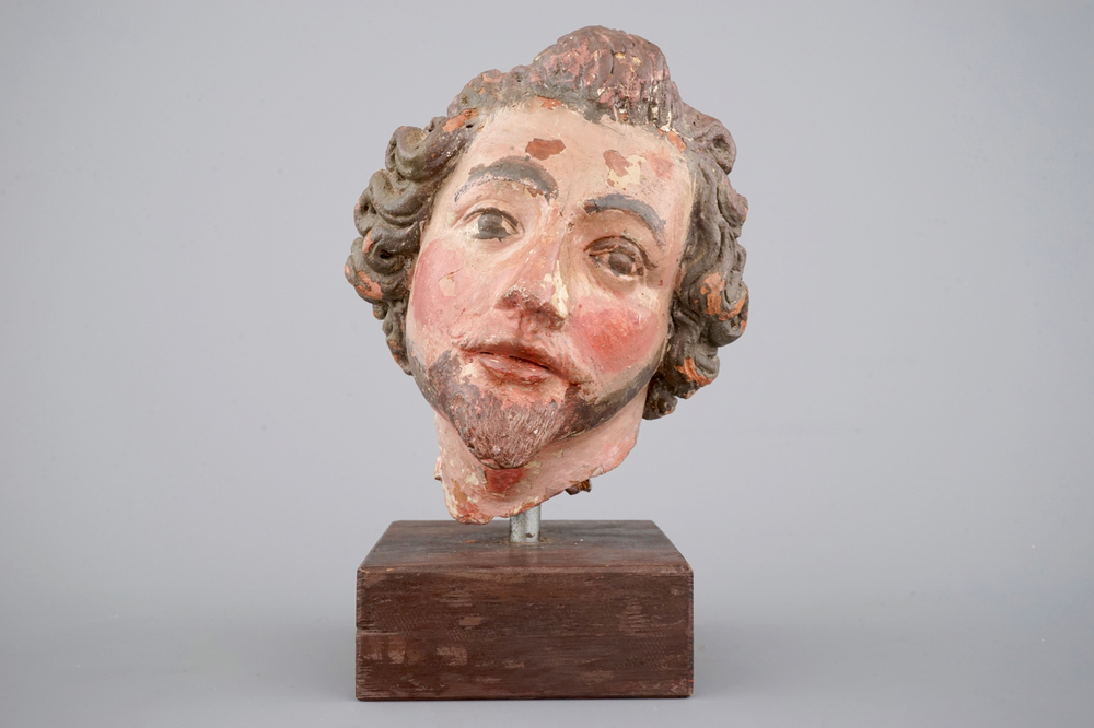 A painted terra cotta head of a saint, probably German, 18th C.